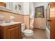 Full bathroom with tile flooring, a wood vanity, and a shower-tub combination at 4125 Lindsey Dr, Decatur, GA 30035