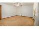 Comfortable bedroom featuring neutral carpet, ceiling fan, and white walls at 4125 Lindsey Dr, Decatur, GA 30035