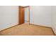 Neutral bedroom features brown carpet, white walls, and a wood door at 4125 Lindsey Dr, Decatur, GA 30035