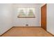 Bedroom featuring neutral carpet and walls, a closet, and natural light from the window at 4125 Lindsey Dr, Decatur, GA 30035