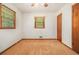 This bedroom has two windows with mini blinds and a ceiling fan with lights at 4125 Lindsey Dr, Decatur, GA 30035