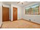 Bedroom with neutral carpet and walls, two closets, and natural light from the window at 4125 Lindsey Dr, Decatur, GA 30035