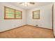 Bedroom with neutral walls and carpet, ceiling fan, and natural light from the windows at 4125 Lindsey Dr, Decatur, GA 30035