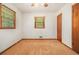 A modest bedroom with windows offering natural light and a ceiling fan for climate control at 4125 Lindsey Dr, Decatur, GA 30035
