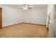 Bright bedroom featuring neutral carpet, fresh white walls, and natural light at 4125 Lindsey Dr, Decatur, GA 30035