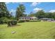 Lush front yard highlighting the brick home and classic architectural details at 4125 Lindsey Dr, Decatur, GA 30035