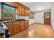 Bright kitchen area with wood cabinets, black countertops, and light-colored flooring at 4125 Lindsey Dr, Decatur, GA 30035
