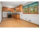 Functional kitchen features wooden cabinetry and black appliances, ready for updates at 4125 Lindsey Dr, Decatur, GA 30035