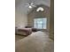 Bedroom with high ceiling, two beds, and a large window for natural light at 636 Lantern Park Ln, Scottdale, GA 30079