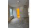 Bedroom with neutral colors, window, and door to adjacent bathroom at 636 Lantern Park Ln, Scottdale, GA 30079