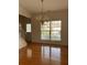 Elegant dining room with hardwood floors and views of the front yard at 636 Lantern Park Ln, Scottdale, GA 30079