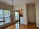Bright dining area with hardwood floors and view of laundry space at 636 Lantern Park Ln, Scottdale, GA 30079