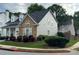 Beautiful exterior view showcasing stone accents, well-maintained landscaping, and a cozy suburban setting at 636 Lantern Park Ln, Scottdale, GA 30079