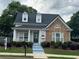 Charming home featuring a stone facade, landscaped front yard, and inviting entrance, perfect for curb appeal at 636 Lantern Park Ln, Scottdale, GA 30079