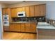 Spacious kitchen featuring modern appliances, ample counter space and hardwood floors at 636 Lantern Park Ln, Scottdale, GA 30079