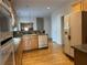 Bright kitchen with stainless steel appliances, wooden cabinets, and hardwood floors at 636 Lantern Park Ln, Scottdale, GA 30079