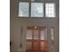 Bright living room with hardwood floors and large windows at 636 Lantern Park Ln, Scottdale, GA 30079