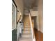 Staircase and stair lift offer accessibility between floors and rooms at 636 Lantern Park Ln, Scottdale, GA 30079