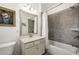 Elegant bathroom featuring a shower-tub combination and a vanity with granite countertops at 1661 Hammock Dr, Smyrna, GA 30080
