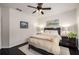 Bright bedroom with a ceiling fan, decorative art, and a comfortable bed at 1661 Hammock Dr, Smyrna, GA 30080