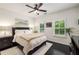 A bedroom with a ceiling fan, shuttered windows, and a modern bed frame at 1661 Hammock Dr, Smyrna, GA 30080