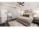 Spacious bedroom with dark hardwood floors and tray ceilings, featuring a decorative mirror at 1661 Hammock Dr, Smyrna, GA 30080