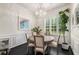Bright dining room featuring elegant chandelier, wood table and hardwood floors at 1661 Hammock Dr, Smyrna, GA 30080