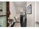 Modern home entryway with black hardwood floors, white walls and decor at 1661 Hammock Dr, Smyrna, GA 30080