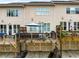Rear view of townhomes with decks and walk out garages at 1661 Hammock Dr, Smyrna, GA 30080