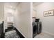 Hallway with laundry area and bedroom in the background at 1661 Hammock Dr, Smyrna, GA 30080