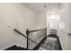 Hallway with decorative rug, leading to a bedroom with shuttered windows at 1661 Hammock Dr, Smyrna, GA 30080