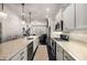 Bright kitchen with a center island, stainless appliances, and dark hardwood floors at 1661 Hammock Dr, Smyrna, GA 30080