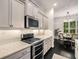 Bright kitchen with stainless steel appliances, oven, and countertops at 1661 Hammock Dr, Smyrna, GA 30080