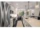 Bright kitchen with a center island, stainless appliances, and dark hardwood floors at 1661 Hammock Dr, Smyrna, GA 30080