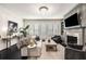 A cozy living room with dark floors, a fireplace, and comfortable seating at 1661 Hammock Dr, Smyrna, GA 30080