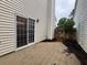 Backyard with concrete patio and sliding glass door at 1822 Commonwealth Dr, Woodstock, GA 30188