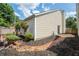 Well-maintained backyard with brick walkway, mature shrubs, and privacy fence, perfect for outdoor enjoyment at 1822 Commonwealth Dr, Woodstock, GA 30188