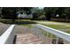 Community basketball court and surrounding green space with an elevated view from a small bridge at 1822 Commonwealth Dr, Woodstock, GA 30188