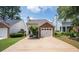 Charming home with a brick-accented garage and well-manicured lawn at 1822 Commonwealth Dr, Woodstock, GA 30188