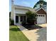 Inviting home exterior with a front yard, driveway, and single car garage, offering curb appeal at 1822 Commonwealth Dr, Woodstock, GA 30188