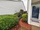 Pathway to front door with landscaped bushes at 1822 Commonwealth Dr, Woodstock, GA 30188