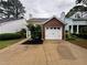Charming townhouse with a one-car garage, well-maintained lawn, and inviting curb appeal at 1822 Commonwealth Dr, Woodstock, GA 30188