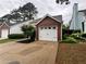 Attached garage with a white door and brick exterior, offering convenient parking and curb appeal at 1822 Commonwealth Dr, Woodstock, GA 30188