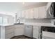 Bright kitchen with sleek countertops, subway tile backsplash, and modern fixtures at 1822 Commonwealth Dr, Woodstock, GA 30188