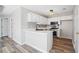 Modern kitchen featuring white cabinetry, sleek countertops, and stainless steel appliances at 1822 Commonwealth Dr, Woodstock, GA 30188