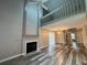 Open-concept living room with a cozy fireplace and plenty of natural light at 1822 Commonwealth Dr, Woodstock, GA 30188