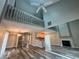 Bright and airy living room featuring high ceilings, fireplace, and wood-look flooring at 1822 Commonwealth Dr, Woodstock, GA 30188