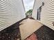 Side yard with mulch and brick pathway at 1822 Commonwealth Dr, Woodstock, GA 30188