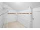 Practical walk-in closet with ample shelving for organized storage and easy access to your wardrobe at 1822 Commonwealth Dr, Woodstock, GA 30188