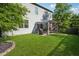 The backyard features a cozy pergola and an expansive lawn, perfect for outdoor enjoyment at 2127 Apple Orchard Way, Austell, GA 30168